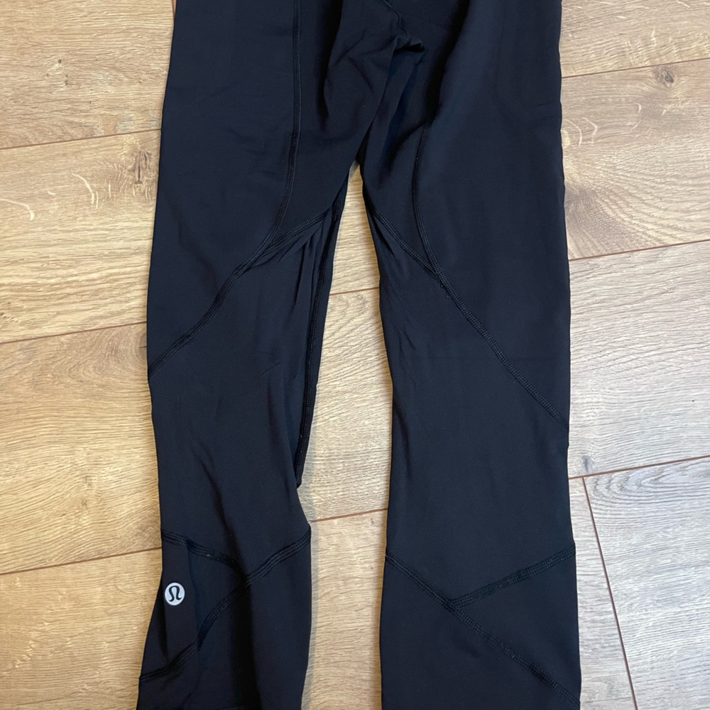 Lululemon cropped black leggings with mesh behind the knee detail